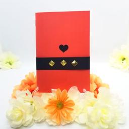 Orange book cover with heart and ribbon clasp